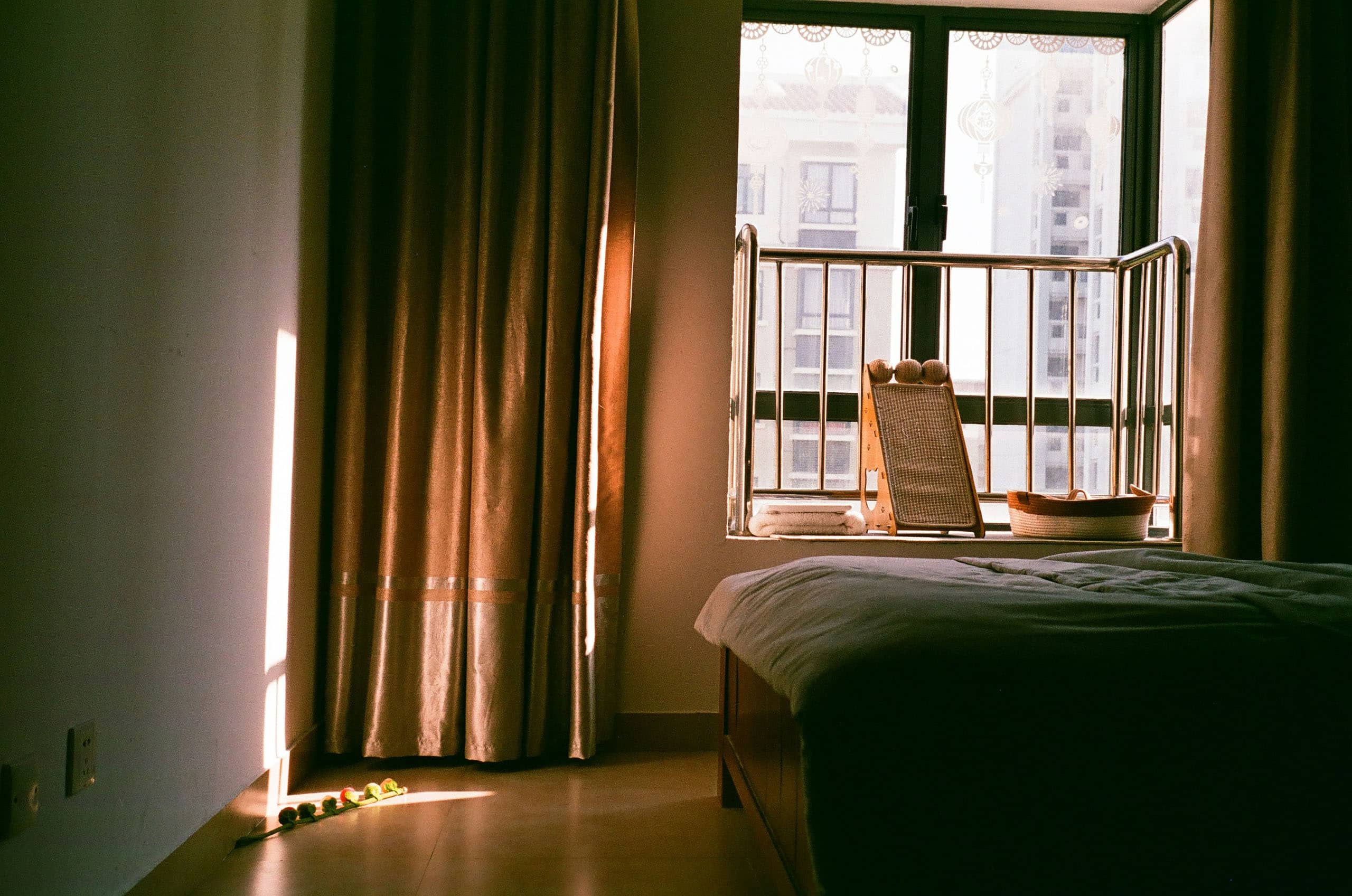 Warm bedroom with curtains and rich tones